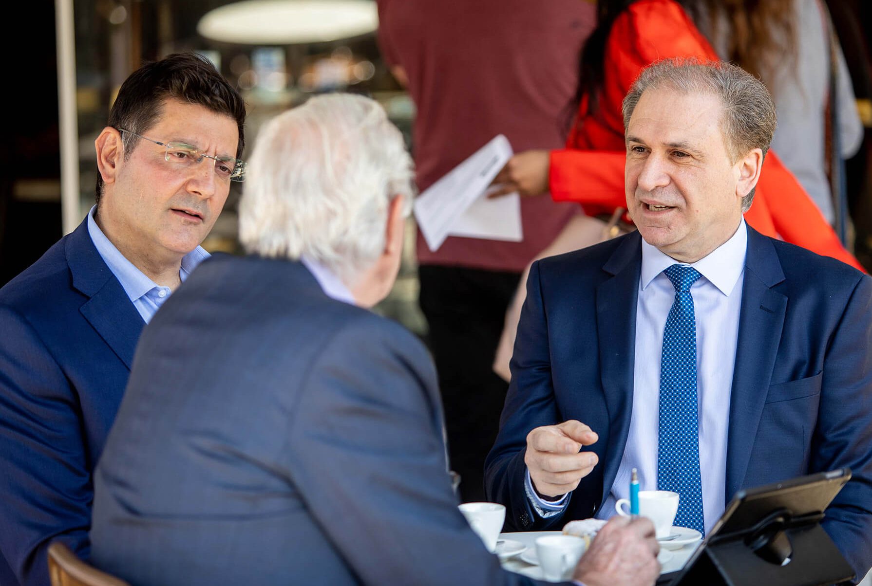 3 men having a business meeting in a cafe for Taxation & Accounting