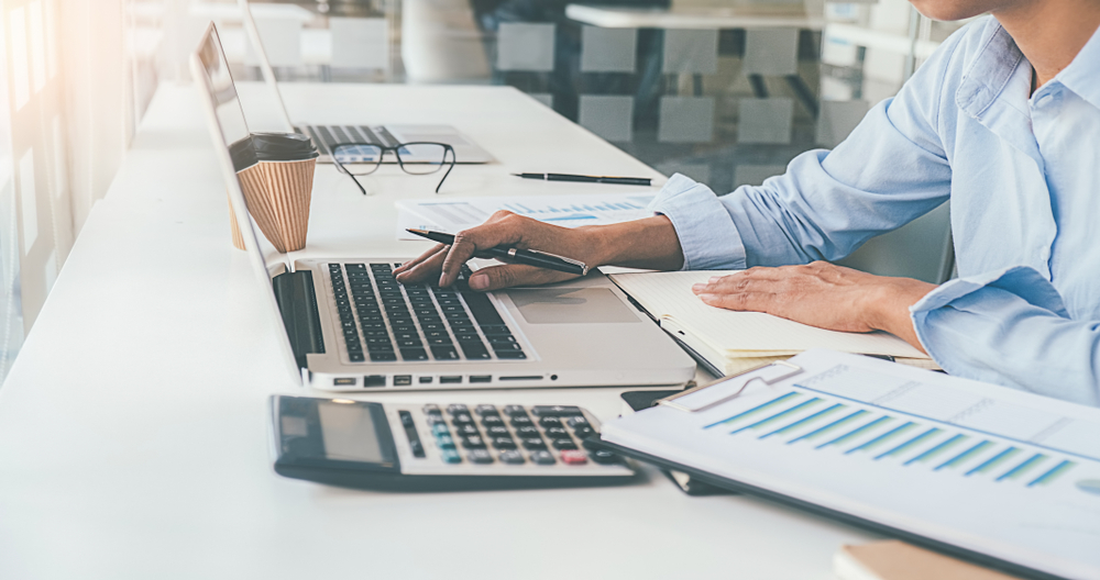 Secretary Making Report Calculating for business accounting services