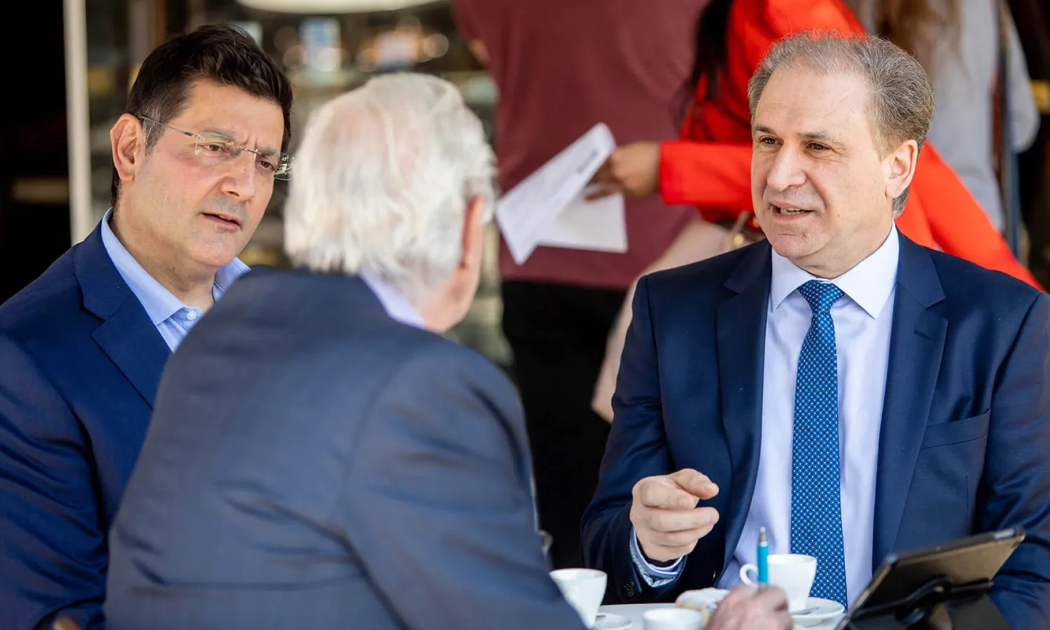 3 men having a business meeting in a cafe for Taxation & Accounting